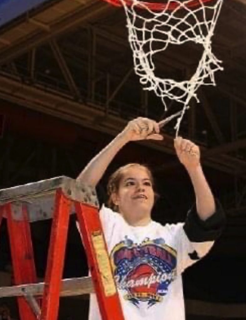 Young Kara cuts net of basketball hoop